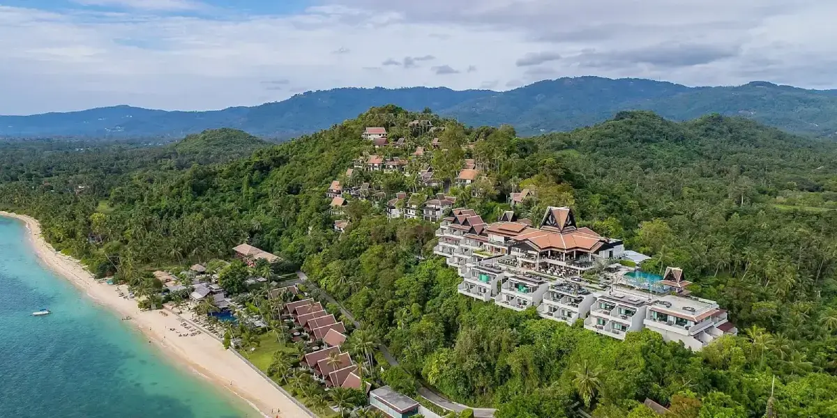View of lush luxury resort on wooded mountainside in Koh Samui