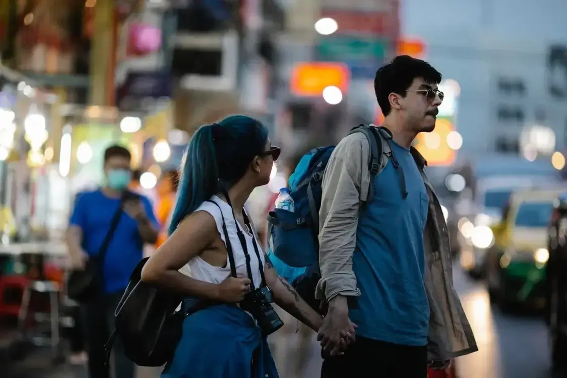 Man and woman shopping in Thailand