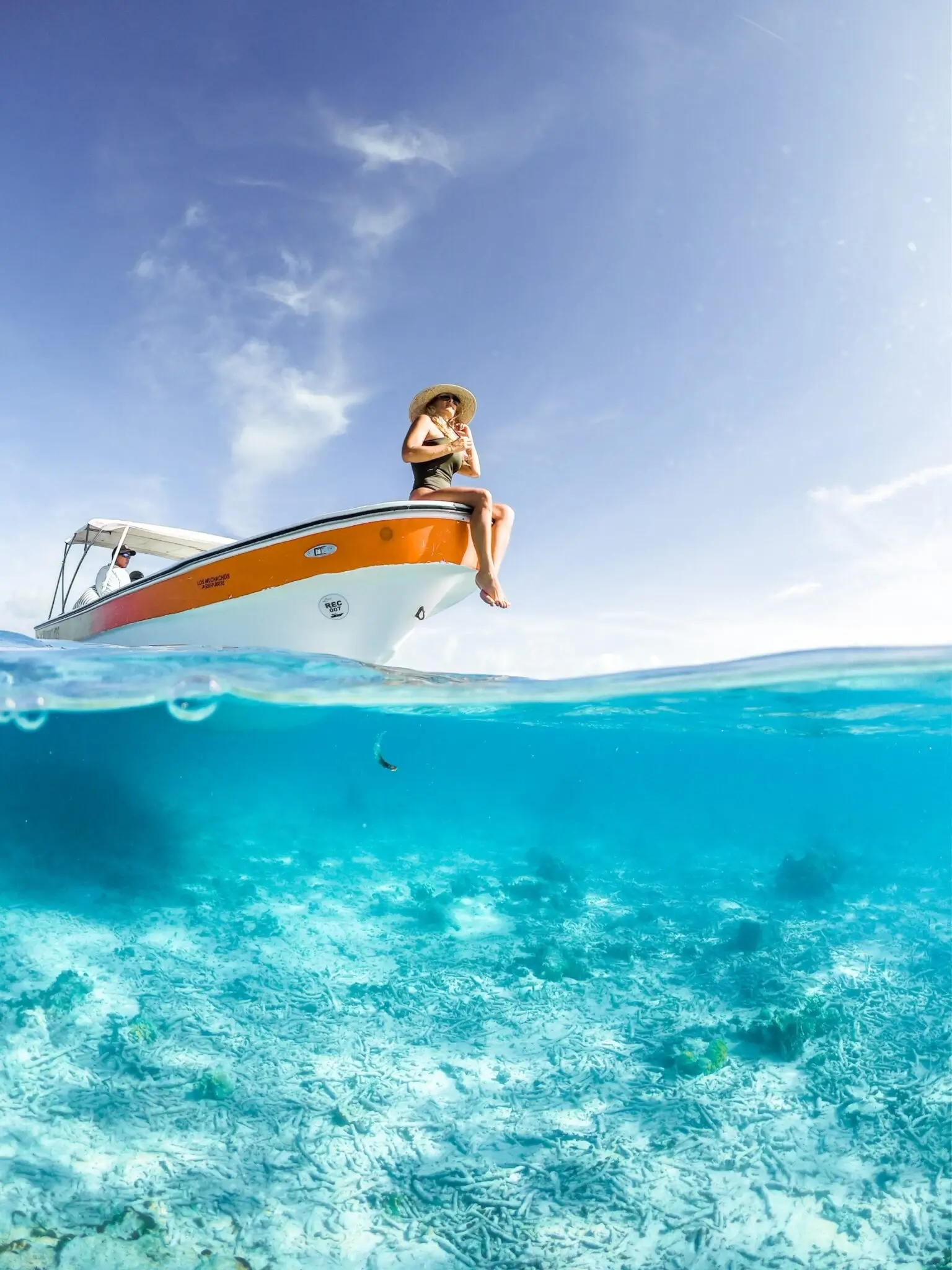 Girl sitting on a boat during a private tour.