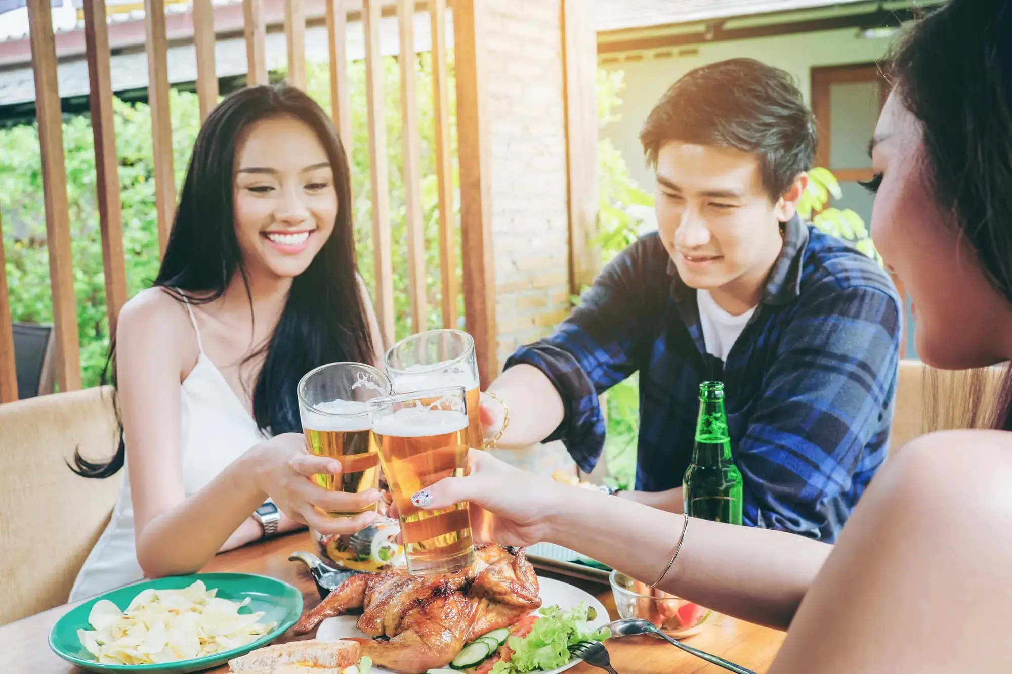 Young Thai people enjoying a beer